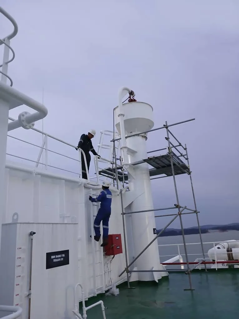 MHA AUTOMATION mechanical team working on deck equipment with scaffolding on a vessel